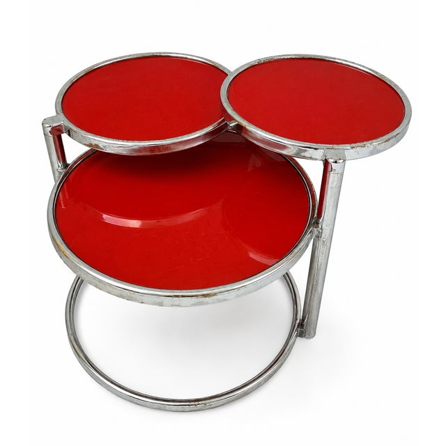Retro vintage 1970s coffee table with three levels, red glass top, steel pyramid frame. Dimensions: Height 44 cm, Width 58...