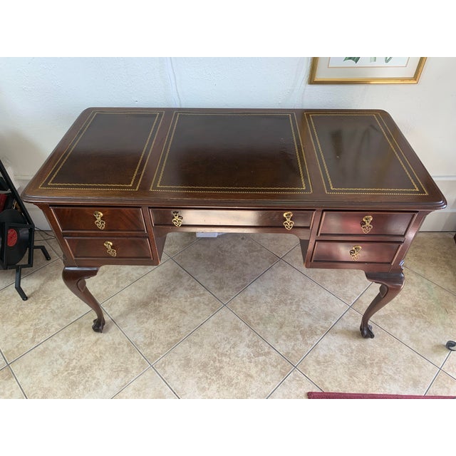 Elegant vintage Georgian-style writing desk crafted in rich mahogany, showcasing timeless traditional design and refined...