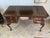 Elegant vintage Georgian-style writing desk crafted in rich mahogany, showcasing timeless traditional design and refined...