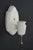 Traditional style white porcelain wall sconce with a pull chain. This sconce requires one Edison style medium base bulb....