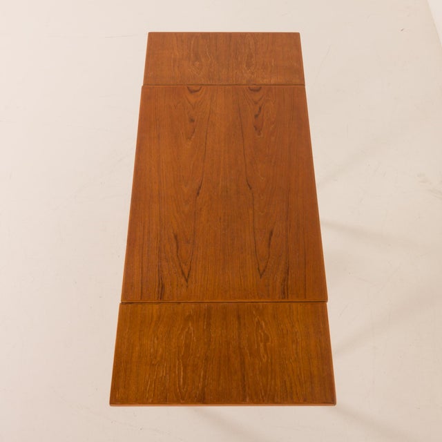 Classic extendable dining table designed and produced in Denmark in the 1970s. It is made in teak veneer with beautifully...