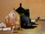 Afternoon Street Scene - Mid Century Figurative Landscape by Rudolf Jacobi A mid century small town afternoon street scene...