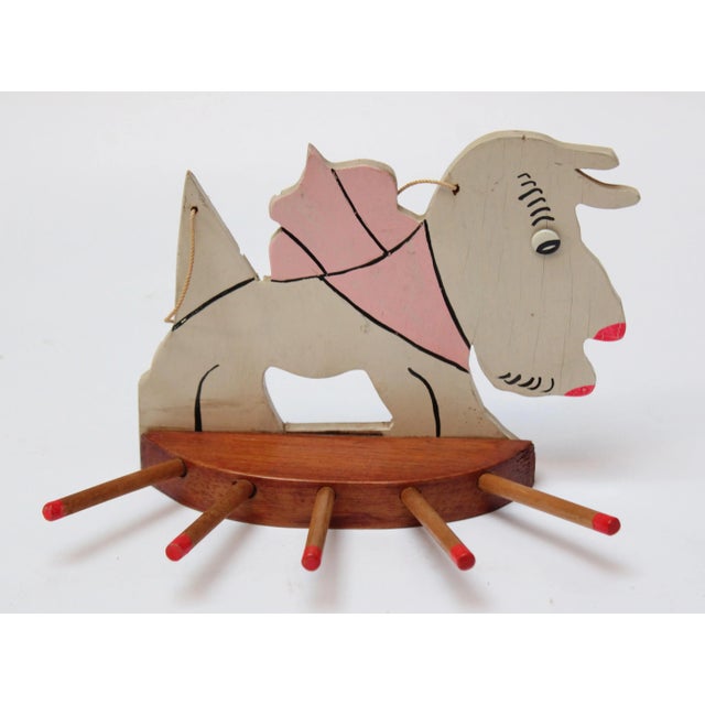 Ca. early 20th Century USA whimsical scottie dog rack with shallow shelf equipped with a string for wall hanging (small...