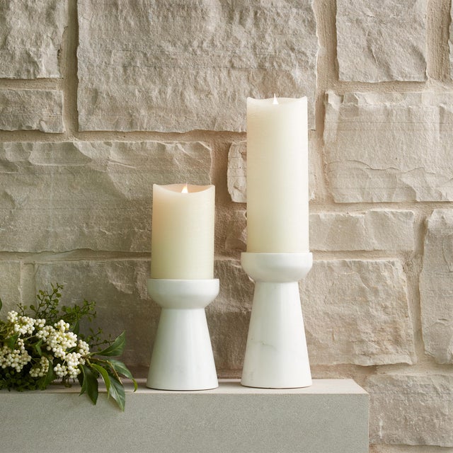 Elevate your home decor with the timeless elegance of this Modern Marble Candle Holder Set. Featuring two assorted sizes...