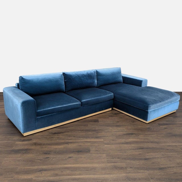 This sectional from Rove Concepts features a rich blue velvet fabric and a sleek light wood base. The modern design offers...