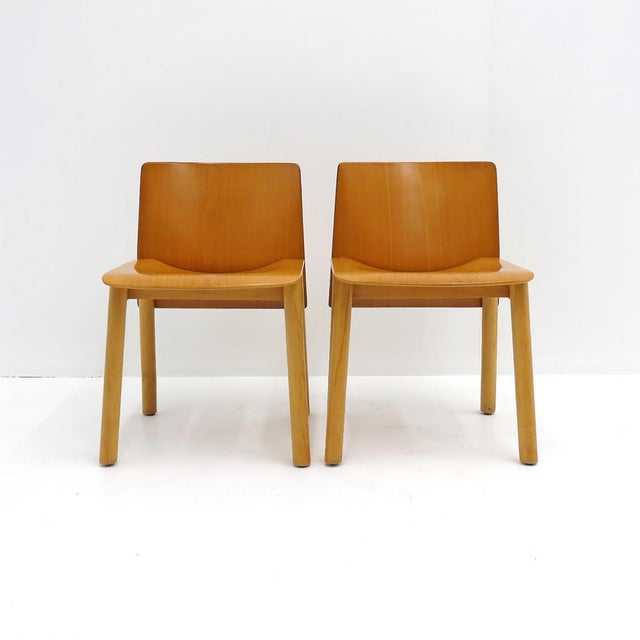 Wonderful, solid wood dining/side chairs with plywood seats, Italy, 1980. Two chairs available. Priced individually.