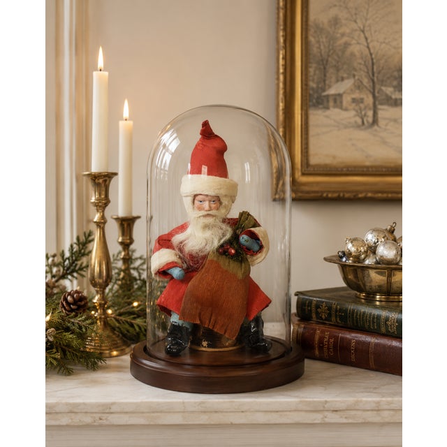 Antique German Santa Claus figure crafted of crepe paper, composition, spun cotton, and mixed media, retaining its...
