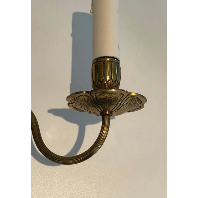 This pair of Louis the 16th style wall sconces is made of bronze. These wall lights are very decorative, they have a large...