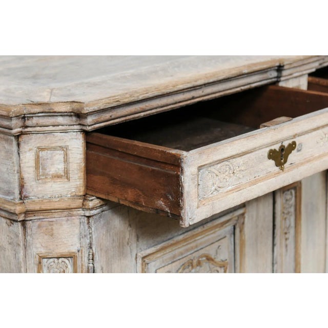 An English carved and painted wood buffet from the 18th century. This antique cabinet from England has been beautifully...