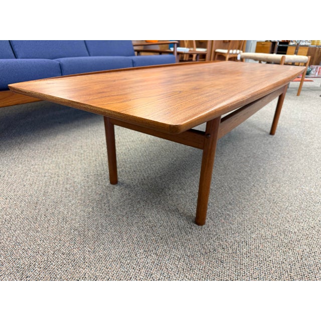 Gorgeous 1960’s Danish teak coffee table designed by Grete Jalk for Poul Jeppesen of Denmark. This is a perfect example of...