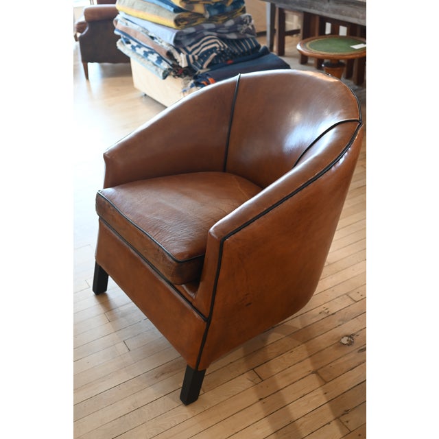 A gorgeous Dutch leather club chair by Bart Van Bekhoven. Legs are wrapped in black leather & in the back leg is a unique...