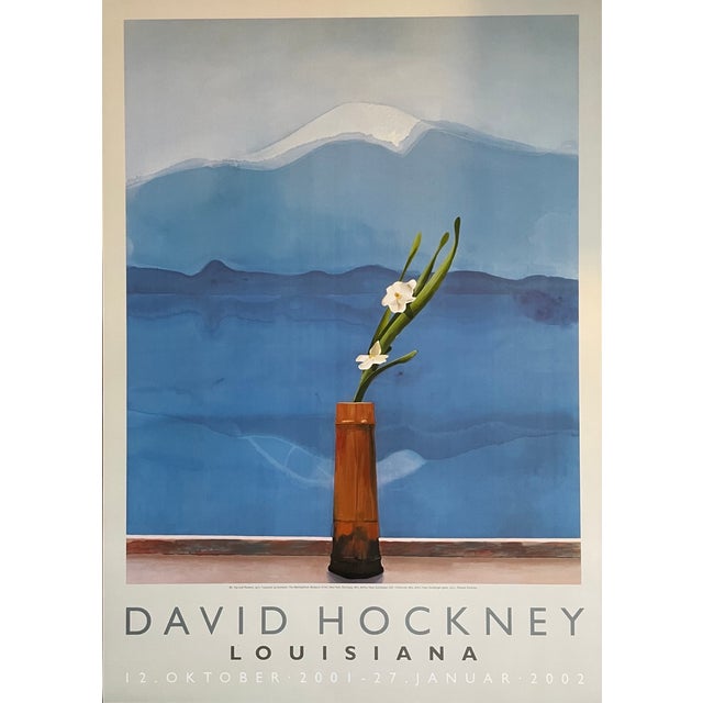 Elevate your space with this striking Louisiana exhibition poster featuring Mt. Fuji and Flowers (1972) by David Hockney...