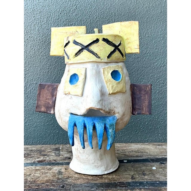 This vintage abstract ceramic bust sculpture presents a whimsical, surrealist take on figural form, its playful...