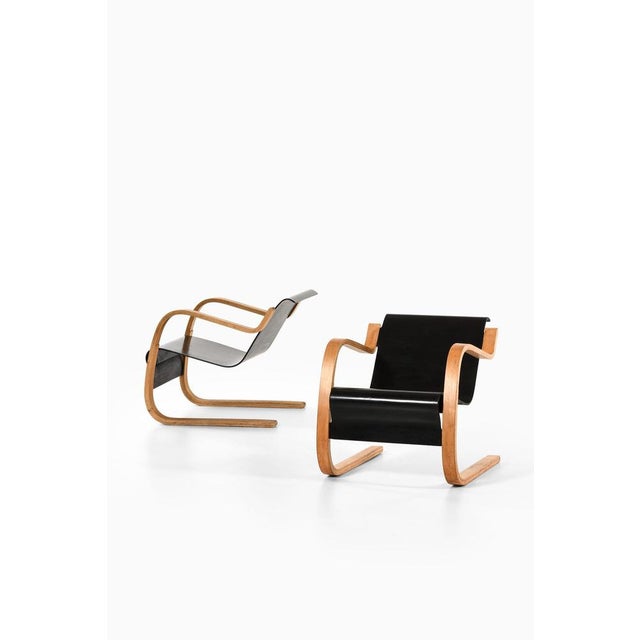 Pair of easy chairs in molded and laminated masurian birch and birch by alvar aalto, 1940's additional information:...