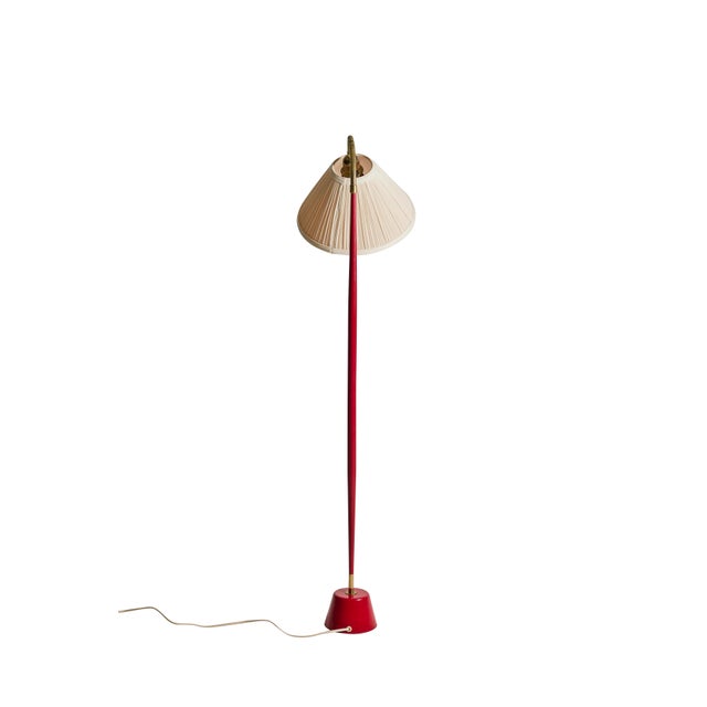 Elegant floor lamp in red with brass details designed by Lisa Johansson-Pape for ASEA. Note: Lampshade not included,...