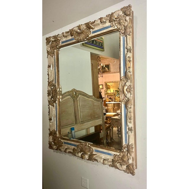 A Monumental French Baroque style mirror, a masterpiece of design and craftsmanship that captures the opulence and...