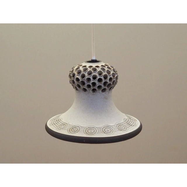 The lamp was made in the 1960s, Danish production. Made of ceramic in beige and brown. The unique construction is not only...