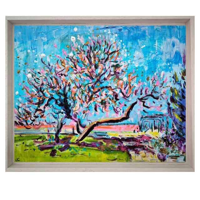 This artwork is an explosion of vibrant, dynamic colors, depicting a tree in full bloom beneath a dazzling sky. The deep...