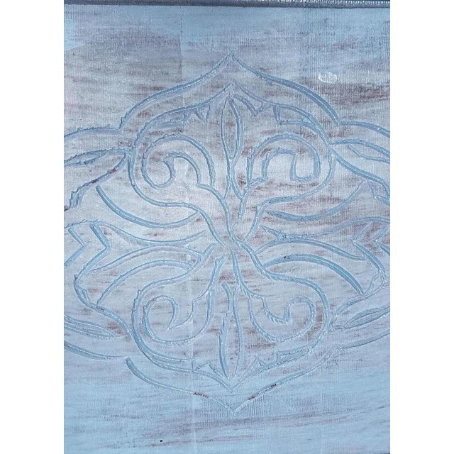 A well carved Moroccan wooden table. Square shape and an amazing look. Color is turquoise. Side table height. With its...