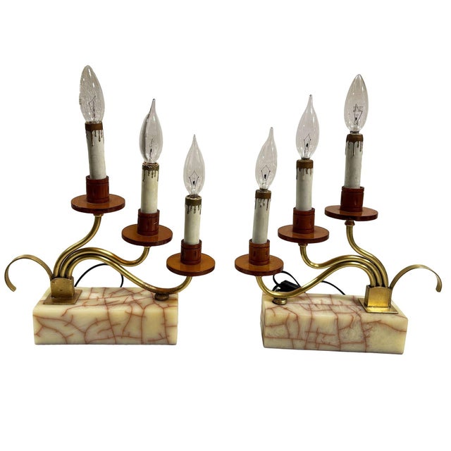 Two pairs of ornate fireplace mantles, each is a three-light candelabra white Bakelite, and brass table lamps. These...