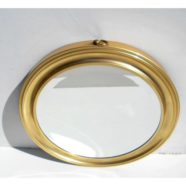 Mirror made by Piglass, Lissone, Italy. Golden aluminium frame. This piece has an attribution mark, I am sure that it is...