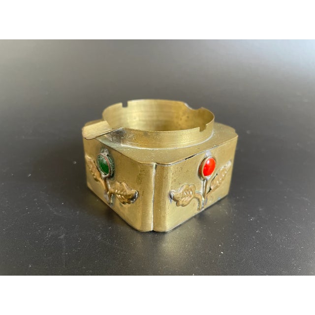 Presenting an antique China export jeweled brass ashtray. The leaves and stems are welded to the four sides, with an...