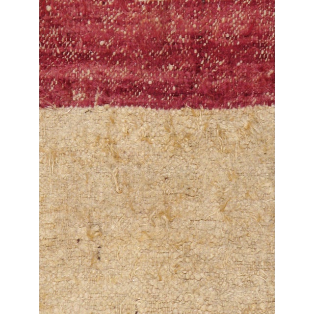 A vintage Tulu Turkish rug from the mid-20th century. A wide plain saturated marsala colored border with a beige open...