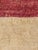 A vintage Tulu Turkish rug from the mid-20th century. A wide plain saturated marsala colored border with a beige open...