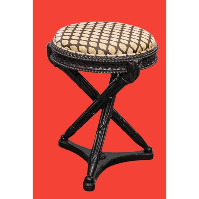 Fabulous Nancy Corzine stool featuring circular upholstered seat on carved hardwood tripod bases with decorative stretcher...