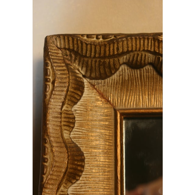 A beautiful Vintage mirror which I think is a plaster over a carved wood design. The mirror is matte gold and white. From...