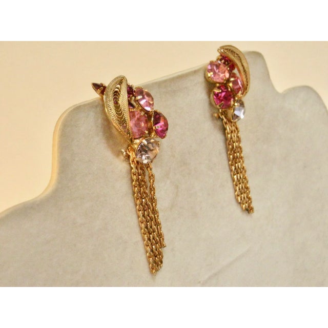 This is part of Chairish’s Costume Jewelry assortment. Stunning mid century gold filigree multi colored glass prong stones...