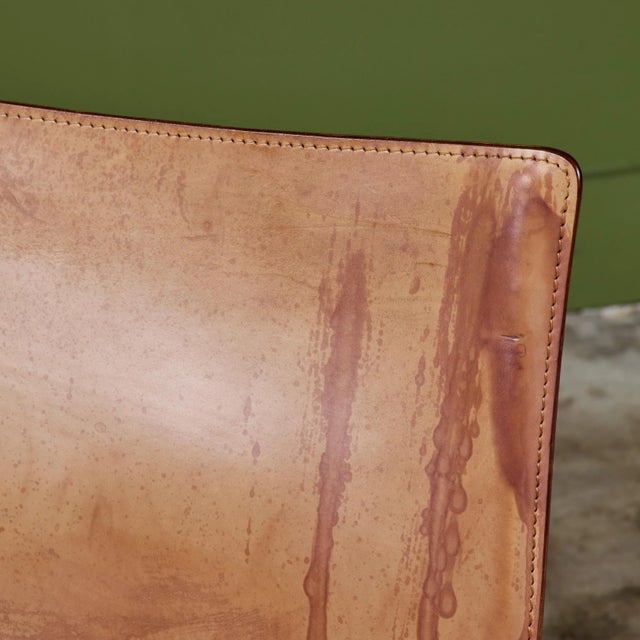 This iconic design by Mario Bellini for Cassina c.1970s, Italy, features the original natural toned saddle leather which...