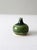 This is a vintage studio pottery vase. Signed by the artist, the handmade bottleneck vase features a striking green ombre...
