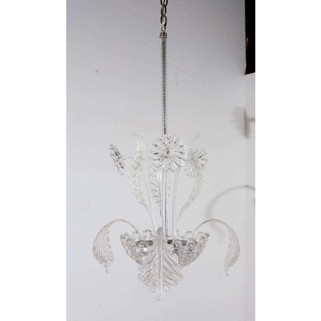Whimsical Murano fixture with glass flowers and leaves. Newly rewired for three candelabra bulbs; each socket can take up...