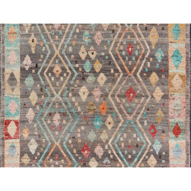 Afghan hand knotted Tribal designed rug in gray and vivid color palette, and all-tribal design. Keivan Woven Arts/rug...
