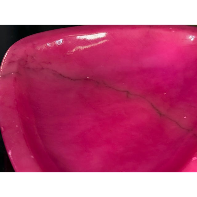 These two Italian alabaster catchalls are dyed a vivid hot pink that highlights the natural veining of the stone, giving...