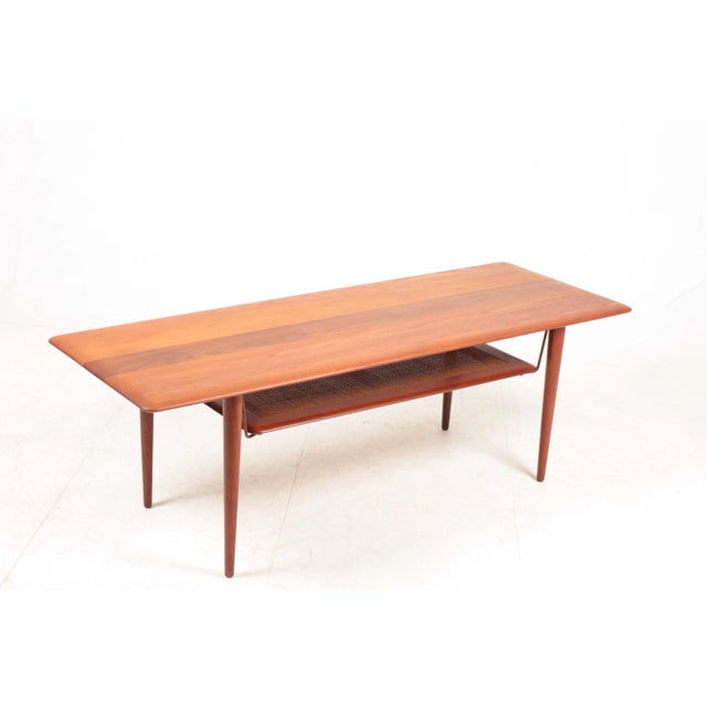 Low table in solid teak and cane. Designed by Peter Hvidt and Orla Mølgaard for France & Son in 1960s. Made in Denmark....