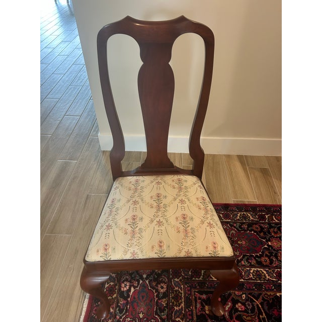 Elegant set of 8 Henkel Harris solid cherry wood dining chairs including 2 armchairs and 6 side chairs. These chairs are...