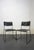 Pair of Italian chairs from the 1980s, manufactured by Spilimbergo. The frame is black metal, and the seat and backrest...