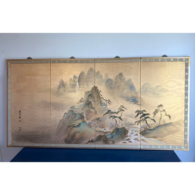 Vintage Japanese Byobu of four hand painted ink panels on Gold Foil, of what appears to be "Mount Penglai Morning Clouds."...