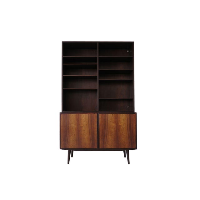 Three Brazilian rosewood cabinets with upper hutch bookcases designed by Omann Jun for Omann Jun Mobelfabrik, Denmark,...