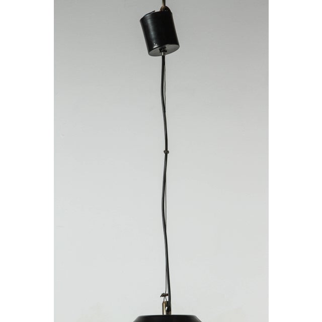 Mazzega Murano pendant with ribbed translucent glass combined with a brass & black pendant fixture.