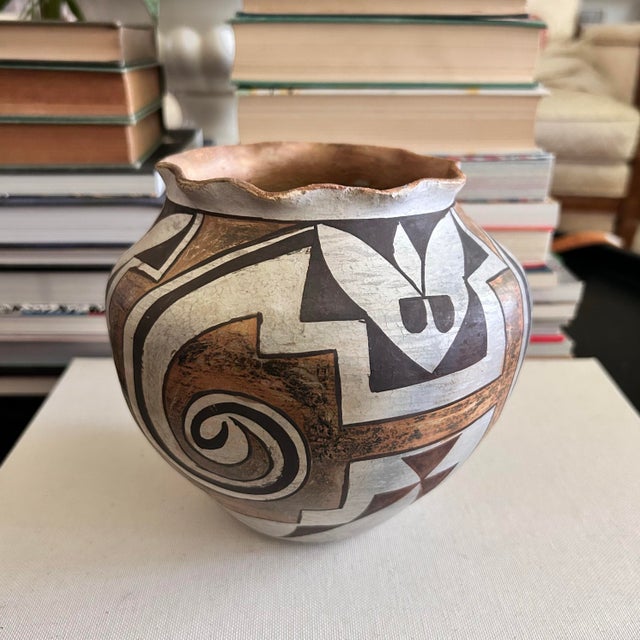 Vintage hand-painted pottery vase marked “Acoma, N. Mex.” on the underside. The rounded olla-style form features bold...