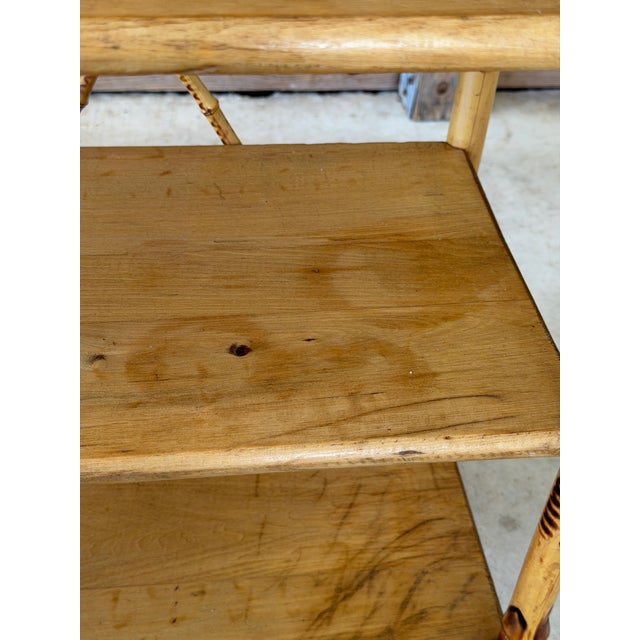 A charming antique Victorian Aesthetic Movement burnt bamboo shelf, dating to the late 19th century. The piece features...