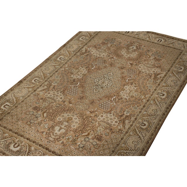 Hand knotted in wool circa 1950-1960, this vintage 5x8 Persian Qum rug joins Rug & Kilim’s coveted Vintage and Vintage...