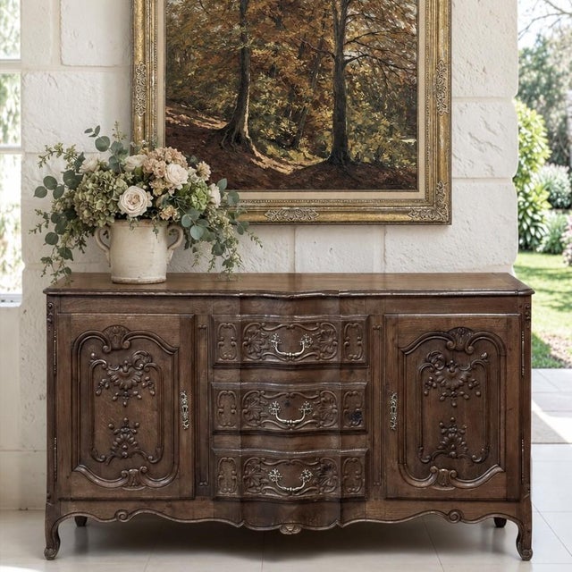 An exceptional Louis XV period buffet from the Liège region of French speaking Belgium, richly carved in solid oak and...