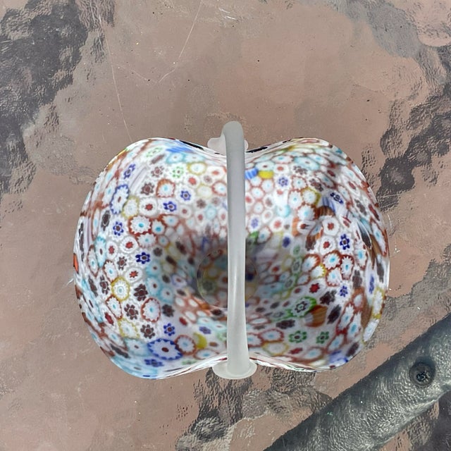 This is a beautiful Millifiore Basket attributed to Fratelli Oswald with a satin glass texture and a clear satin glass...