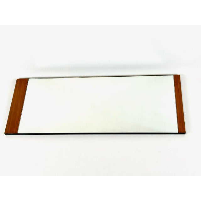 Mid-Century Modern German Wall Mirror in Teak, 1970s, in Very Good conditions. Designed 1970 to 1979