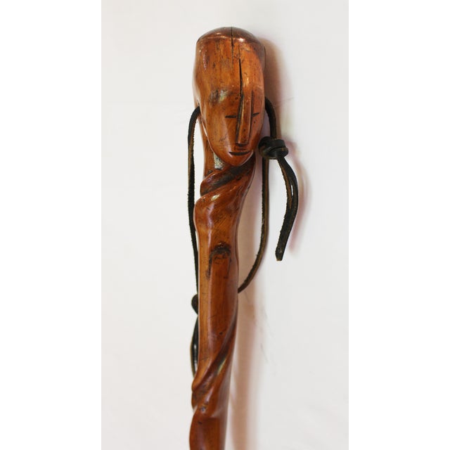 Circa 1900 antique African walking stick. Dense hardwood. Crack at one twist - natural from aging. Colonial era with brass...