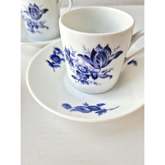 A stunning set of four espresso cups and matching saucers, crafted by the prestigious Italian manufacturer Richard Ginori....